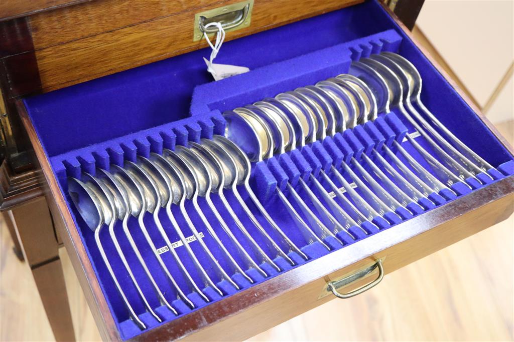 A George V 72 piece canteen of silver cutlery, Old English pattern plus additional cutlery, in a walnut table case